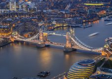London England - Aerial view of the world famous Tower Bridge City Hall and the Tower of London by night